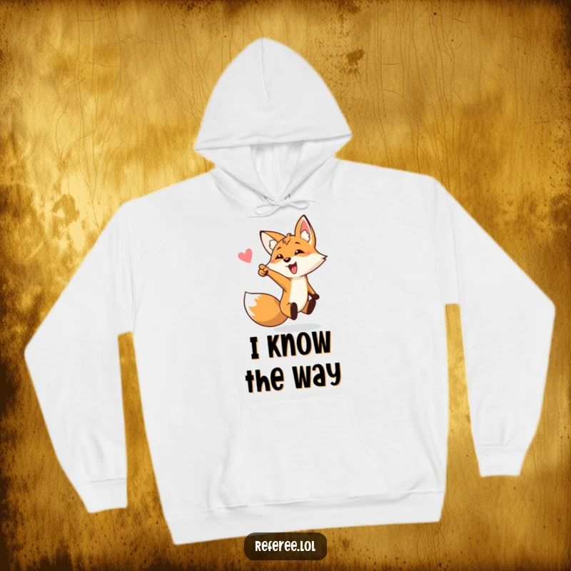 Funny hoodie with a bouncing fox enthusiastically pointing towards a soccer goal, offering warmth and humor as a funny gift.