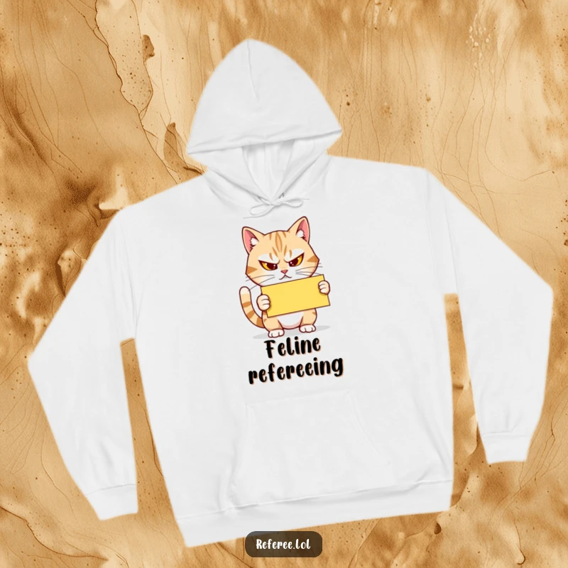 Funny Hoodie: A determined cat squints, holding a yellow card firmly, providing cozy warmth and a humorous, officiating presence.