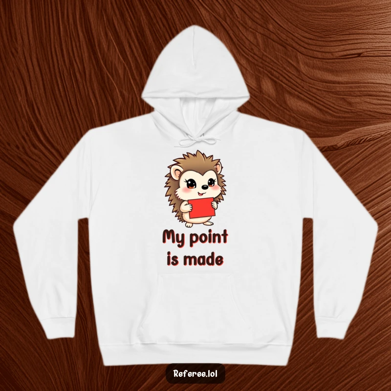 Funny hoodie featuring a determined hedgehog with a red card, offering warmth and humorous appeal for any occasion.